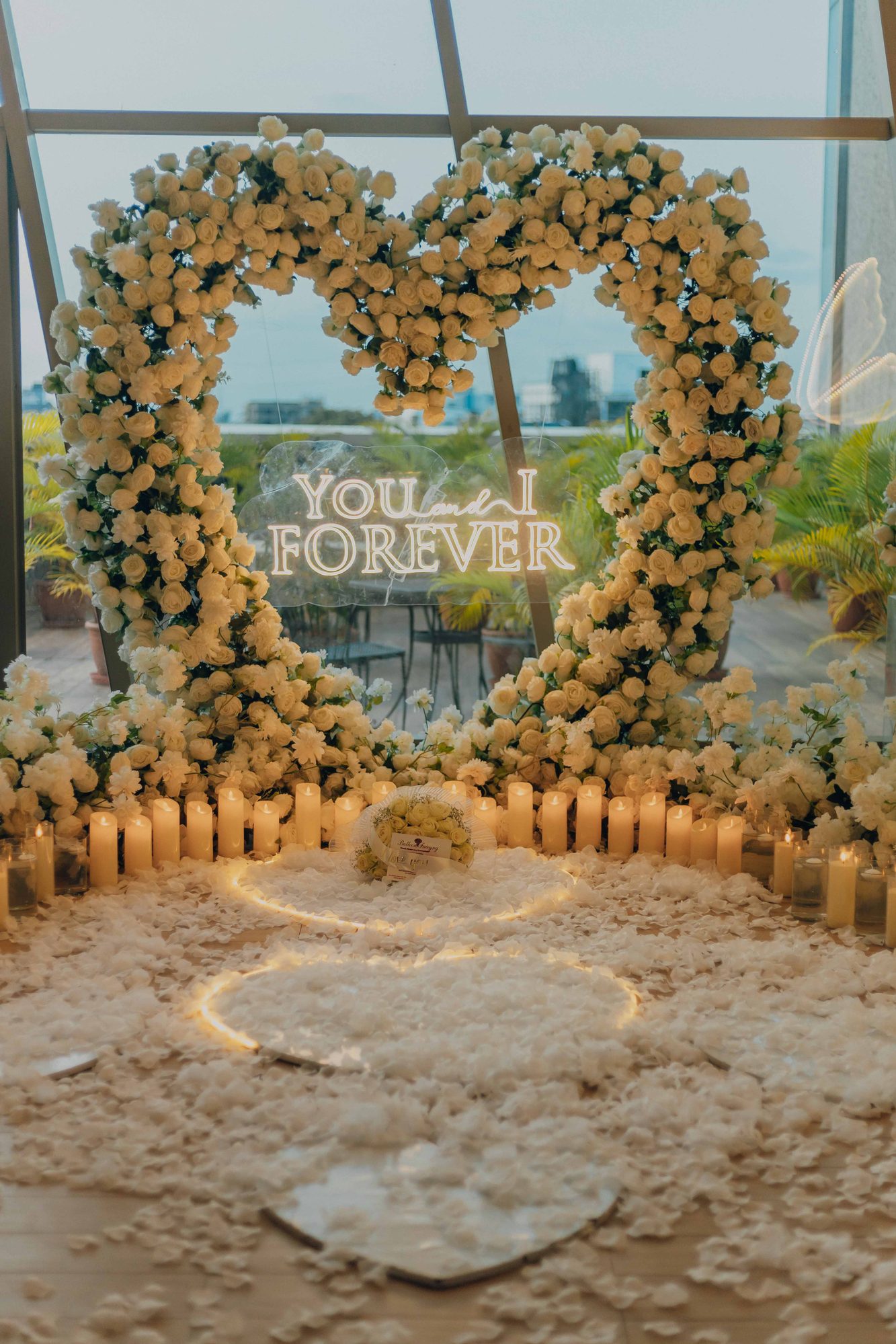Floral heart arch with You and I Forever sign