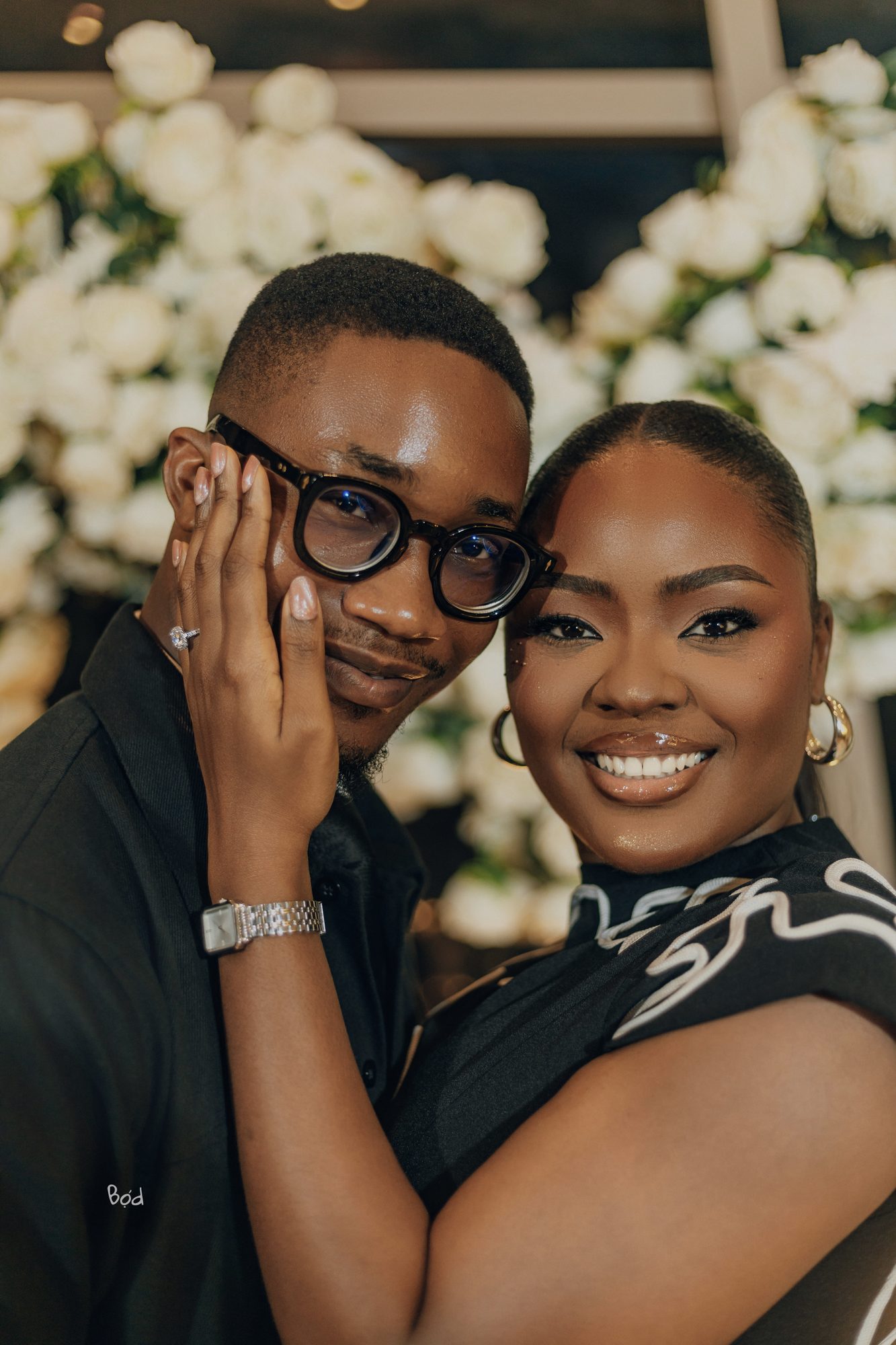 Priscilla and Kelvin smiling closely together